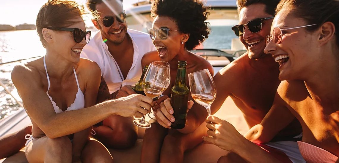 Friends celebrating on a yacht at golden hour